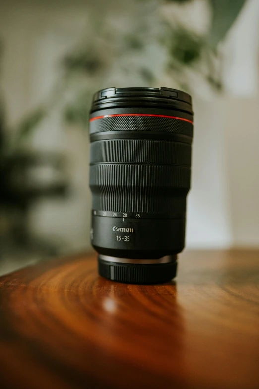 a closeup of a camera lens sitting on a table