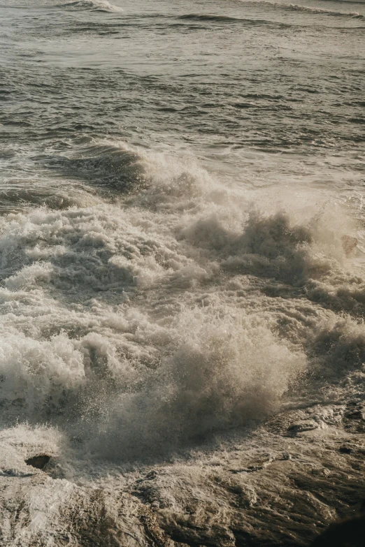 a large body of water with waves crashing around