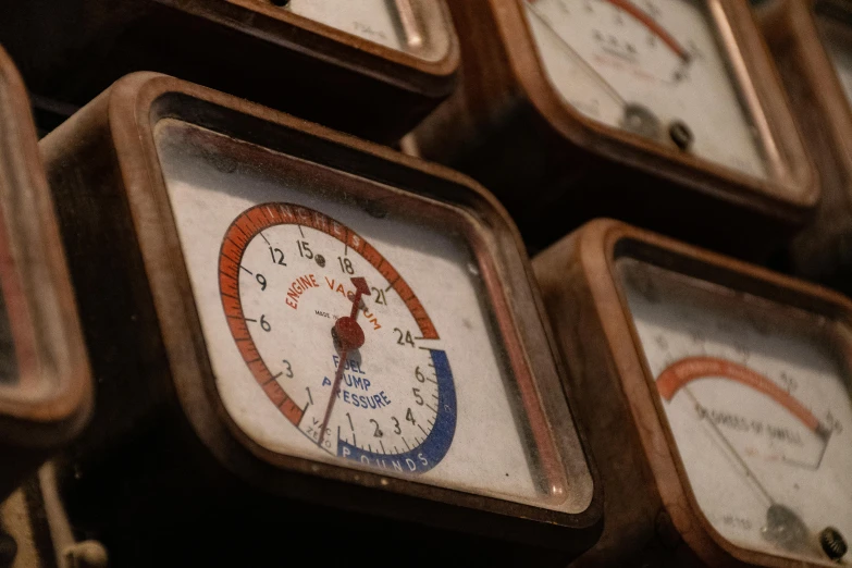 several clocks sitting on top of each other