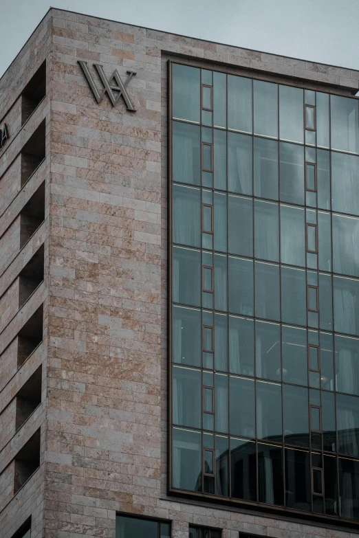 the logo on the side of a large building