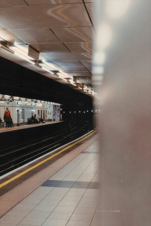 a group of people stand on the platform