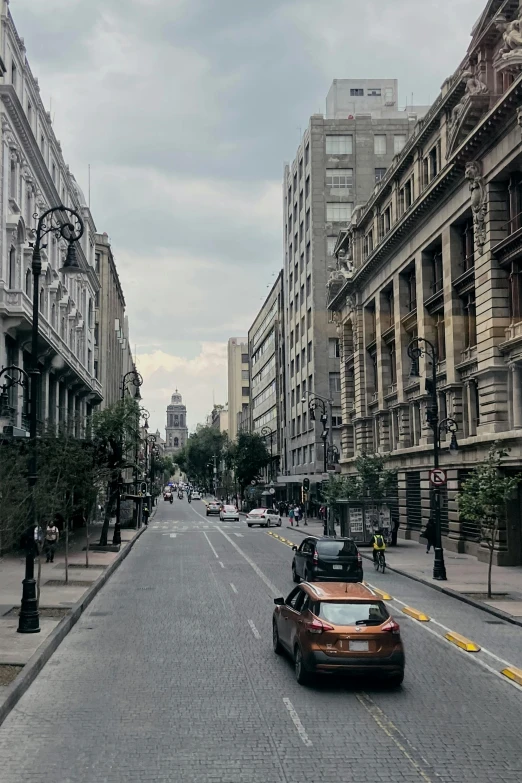 this is an image of a street with cars on the street