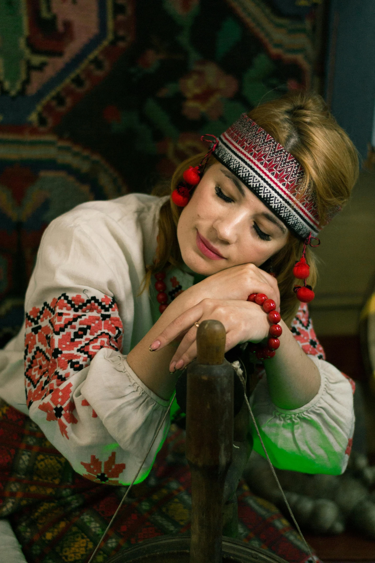 a woman dressed in a red and white outfit and holding a rope