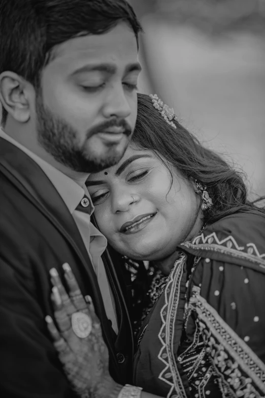 a couple are sharing a kiss while their wedding pictures are taken