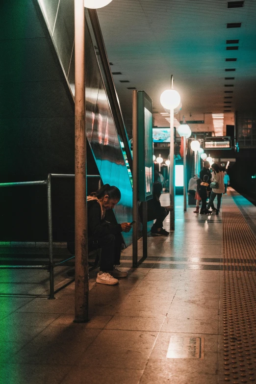 a person with an umbrella sitting next to a window