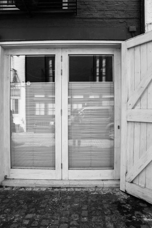 black and white image of a closed door