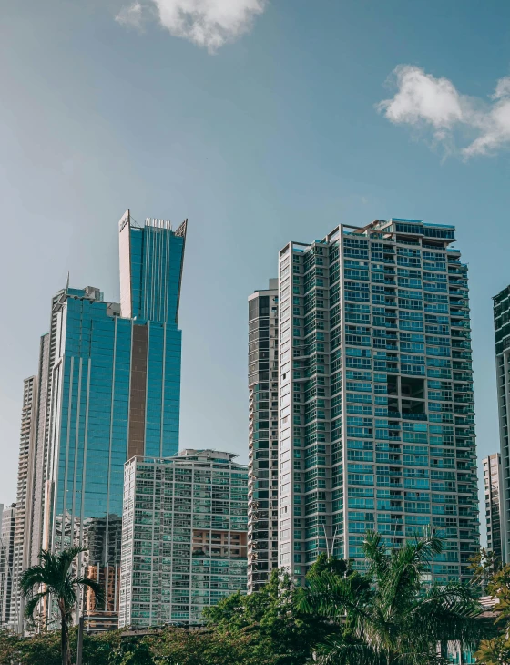 several tall blue buildings sitting beside each other