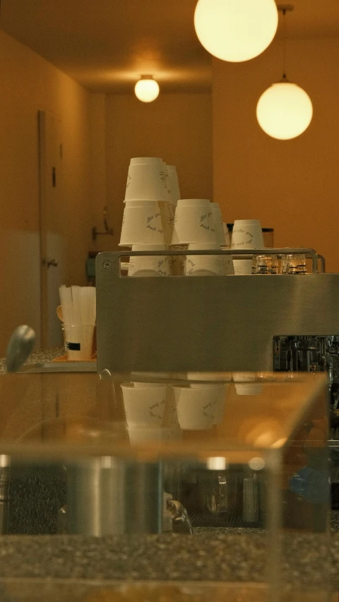 a kitchen filled with lots of white cups