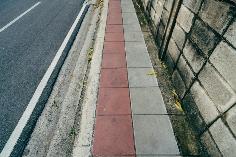 an old time po of an empty sidewalk beside a building