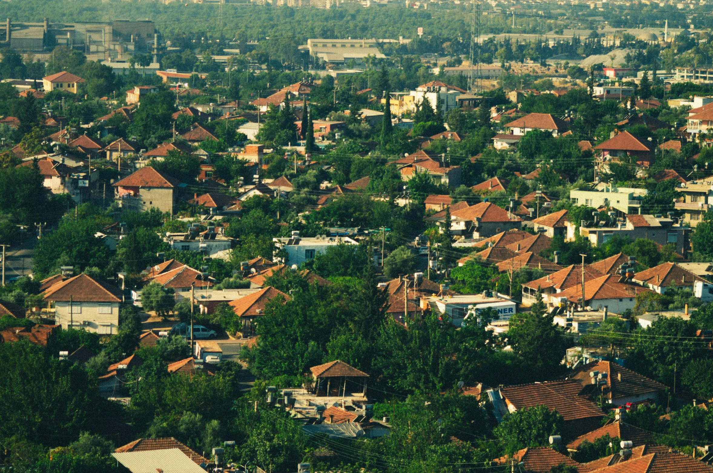 some of the top red tile buildings have brown roofs