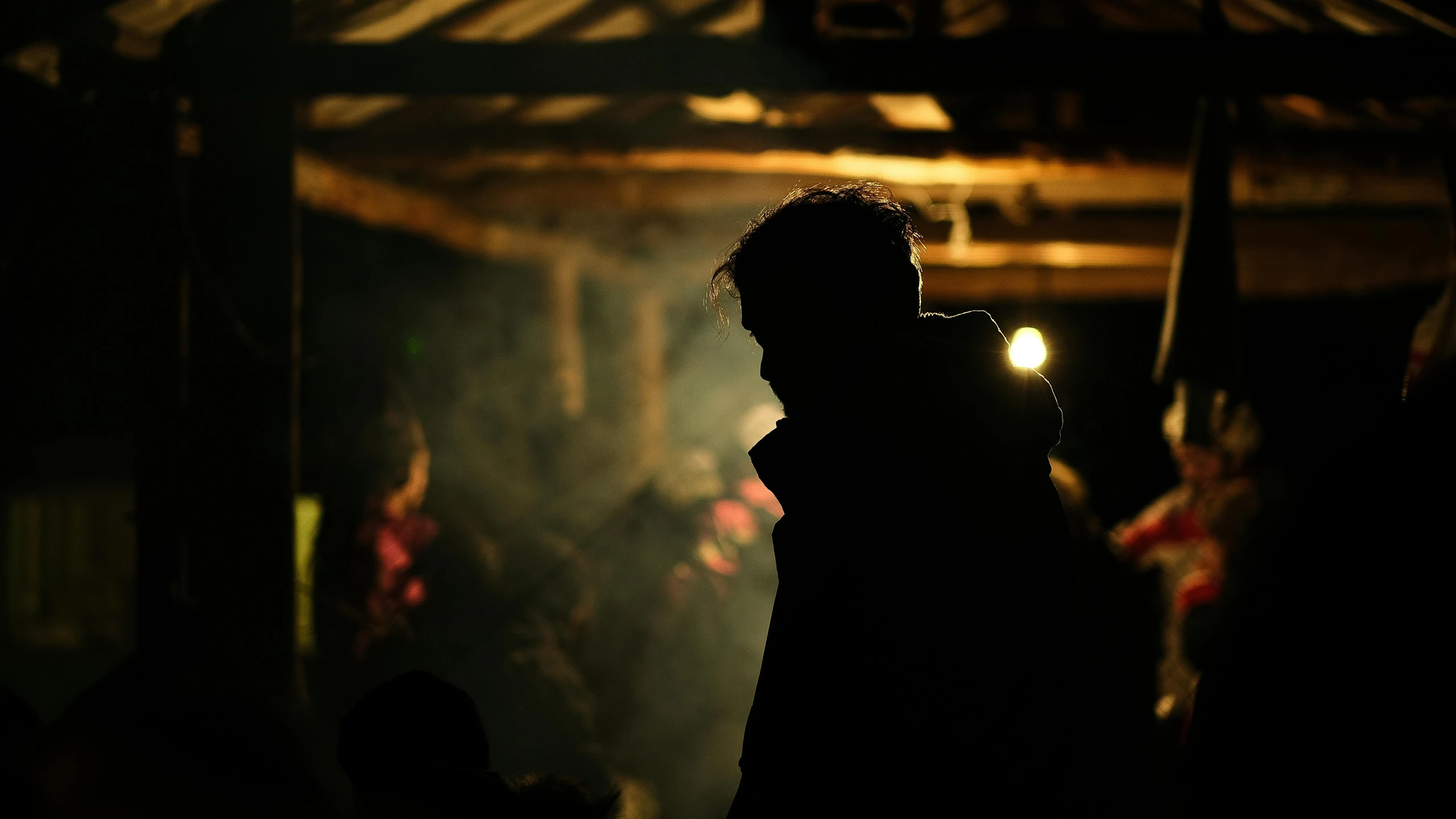 a person is seen through the dark during a show