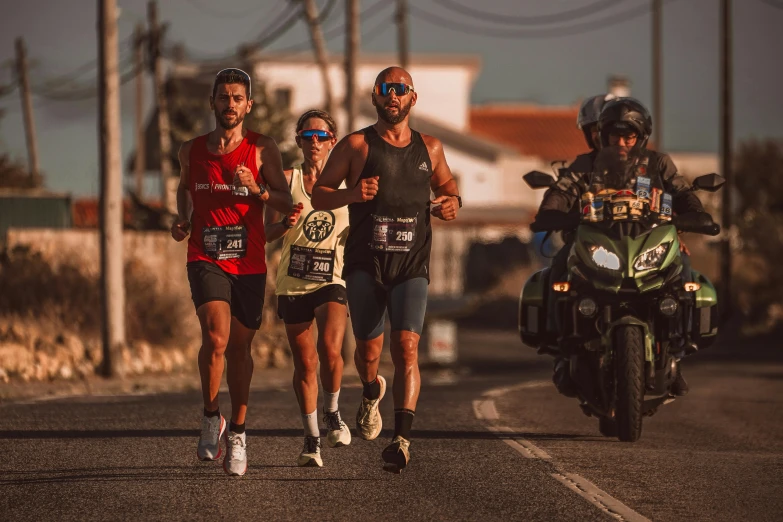 group of people jogging in the street on motor bikes