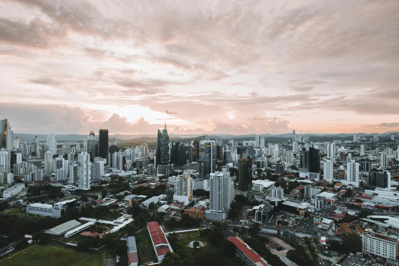 a city skyline as the sun sets over it