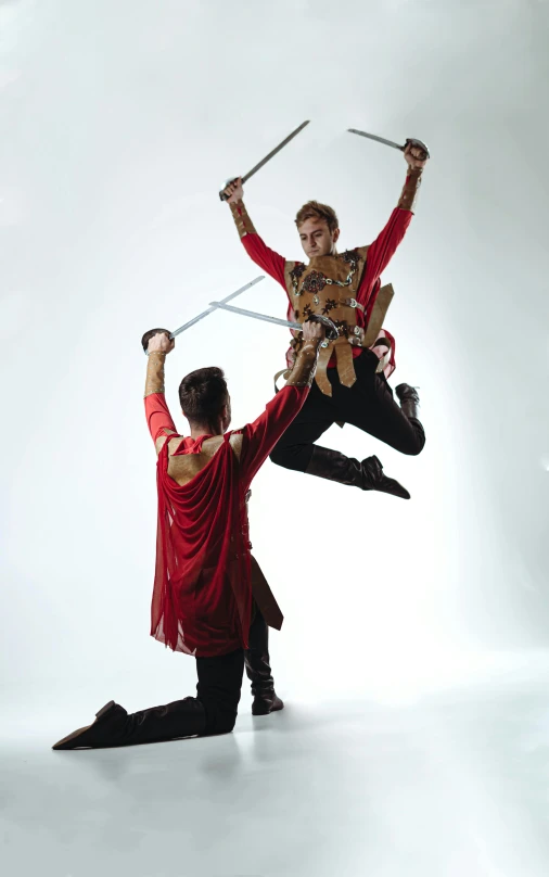 two men on aerial acrobatics while standing in the air