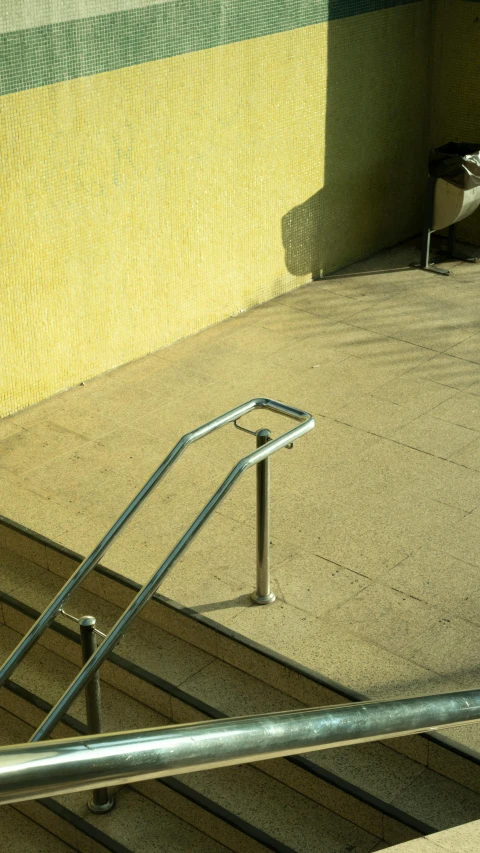 a  riding his skateboard down the stairs