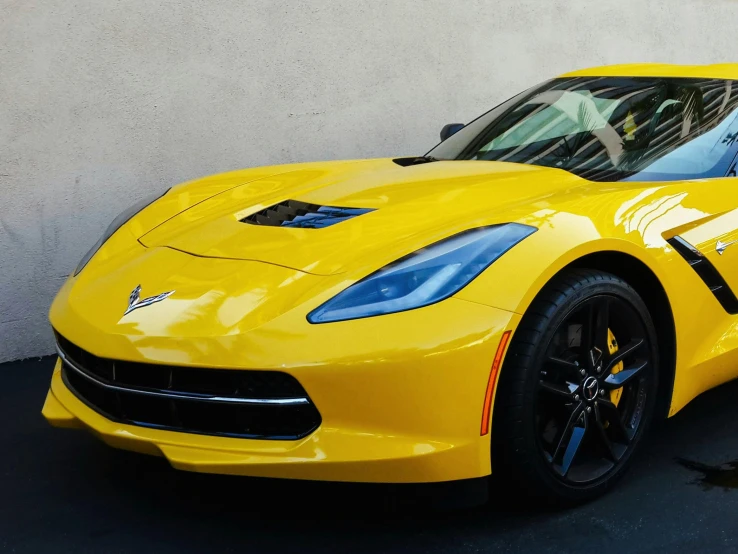 a chevrolet sports car with painted stripes is shown