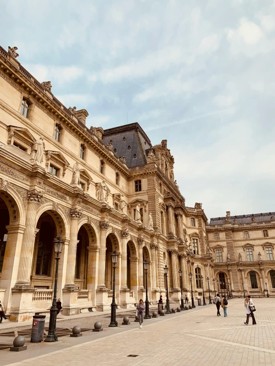 this building has several courtyards, and people walk around