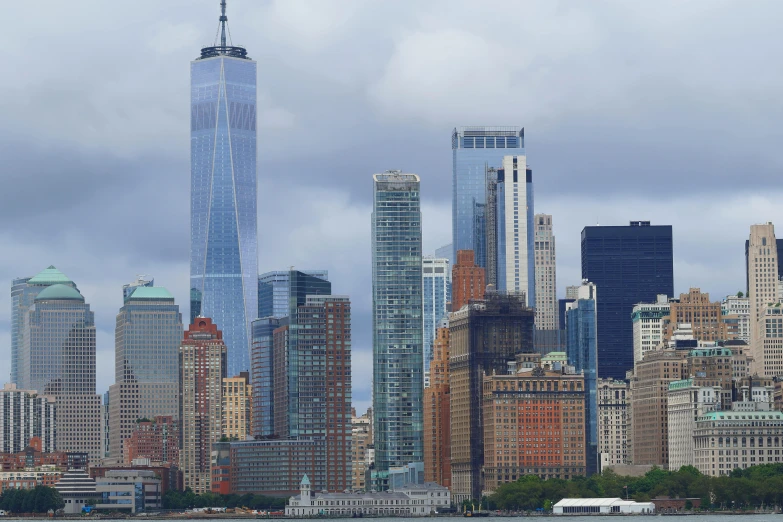 a city with tall buildings with a cloudy sky