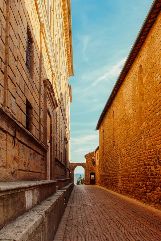 an alley between two old buildings in an ancient city