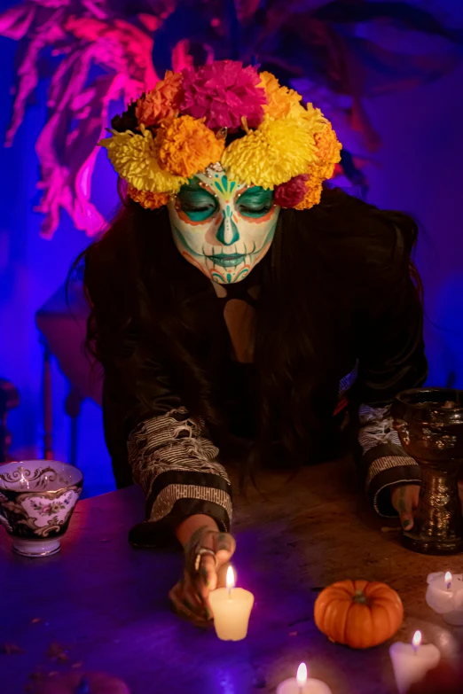 a skeleton is adorned in a flower headdress and gloves