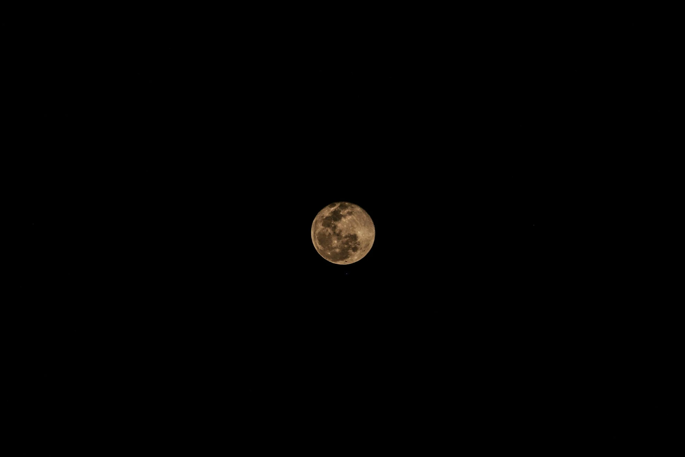 a very large moon in the sky at night