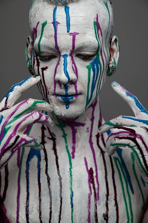 a white face covered in lots of different colors