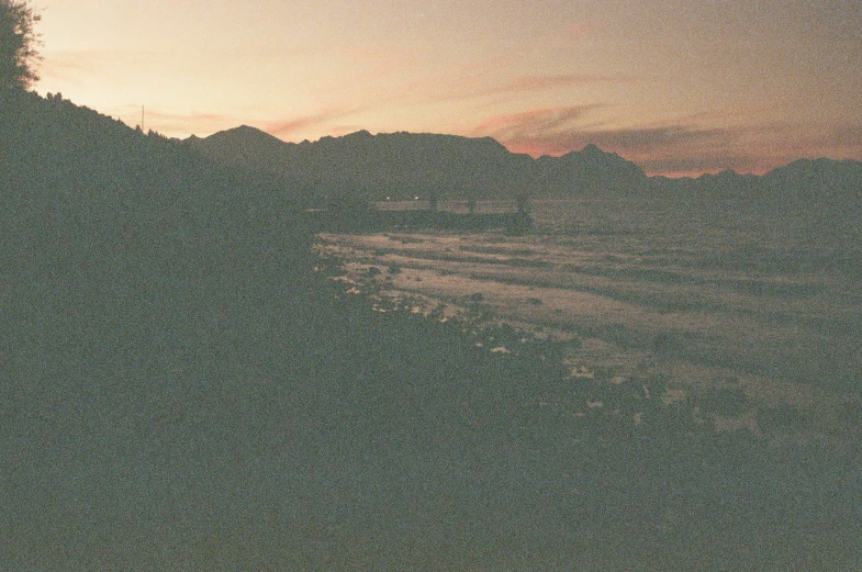 a mountain with a hazy sky with trees