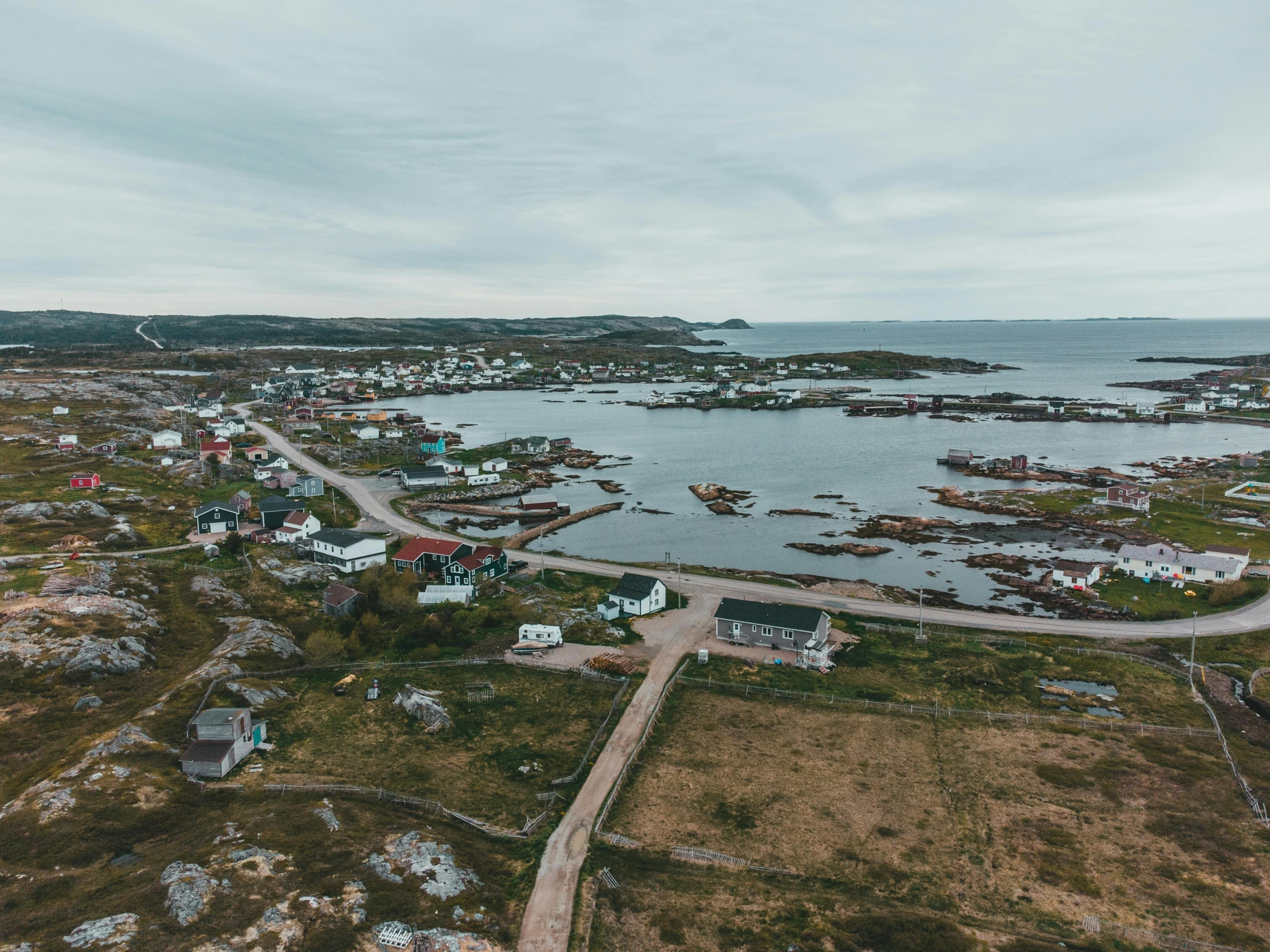 a view of a body of water and many buildings on the land