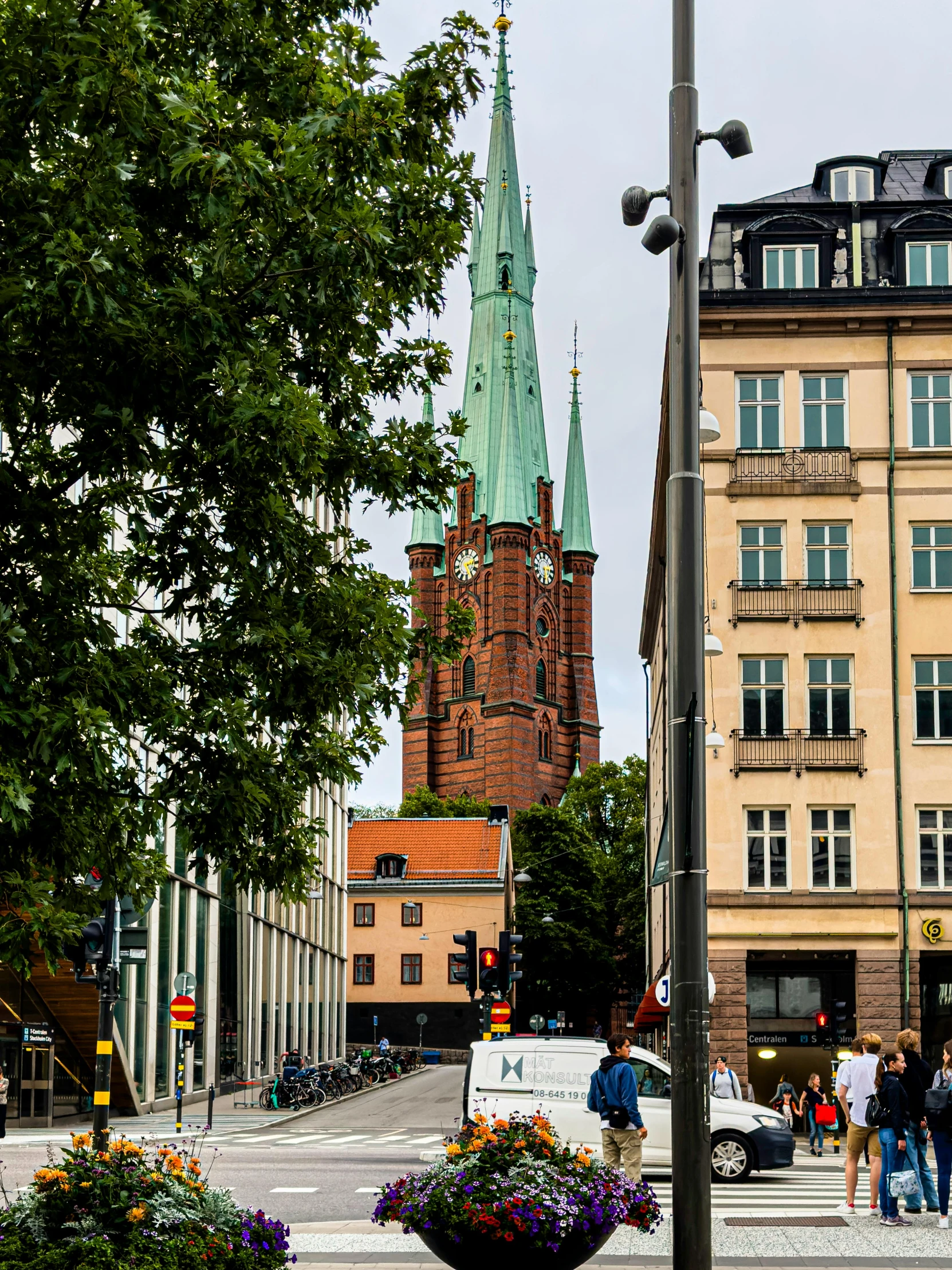 the town square has a tall clock tower on one side