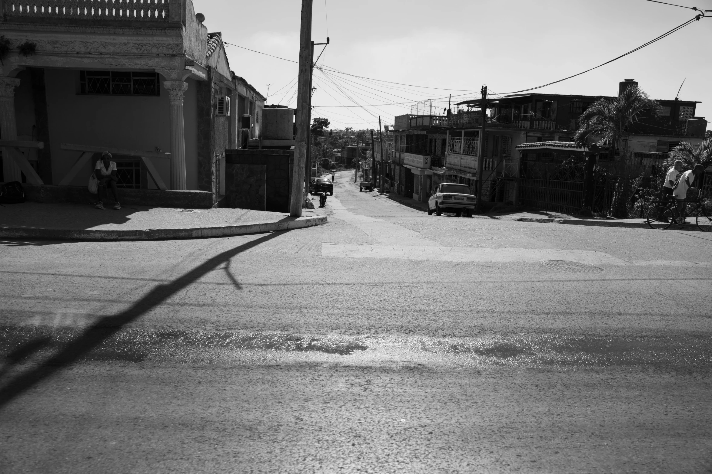 a city street with lots of cars parked next to it