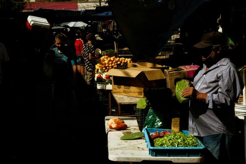 an outdoor market with people on it