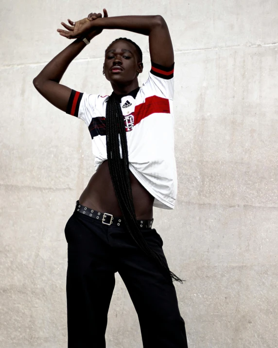 a young black man in a white shirt and tie