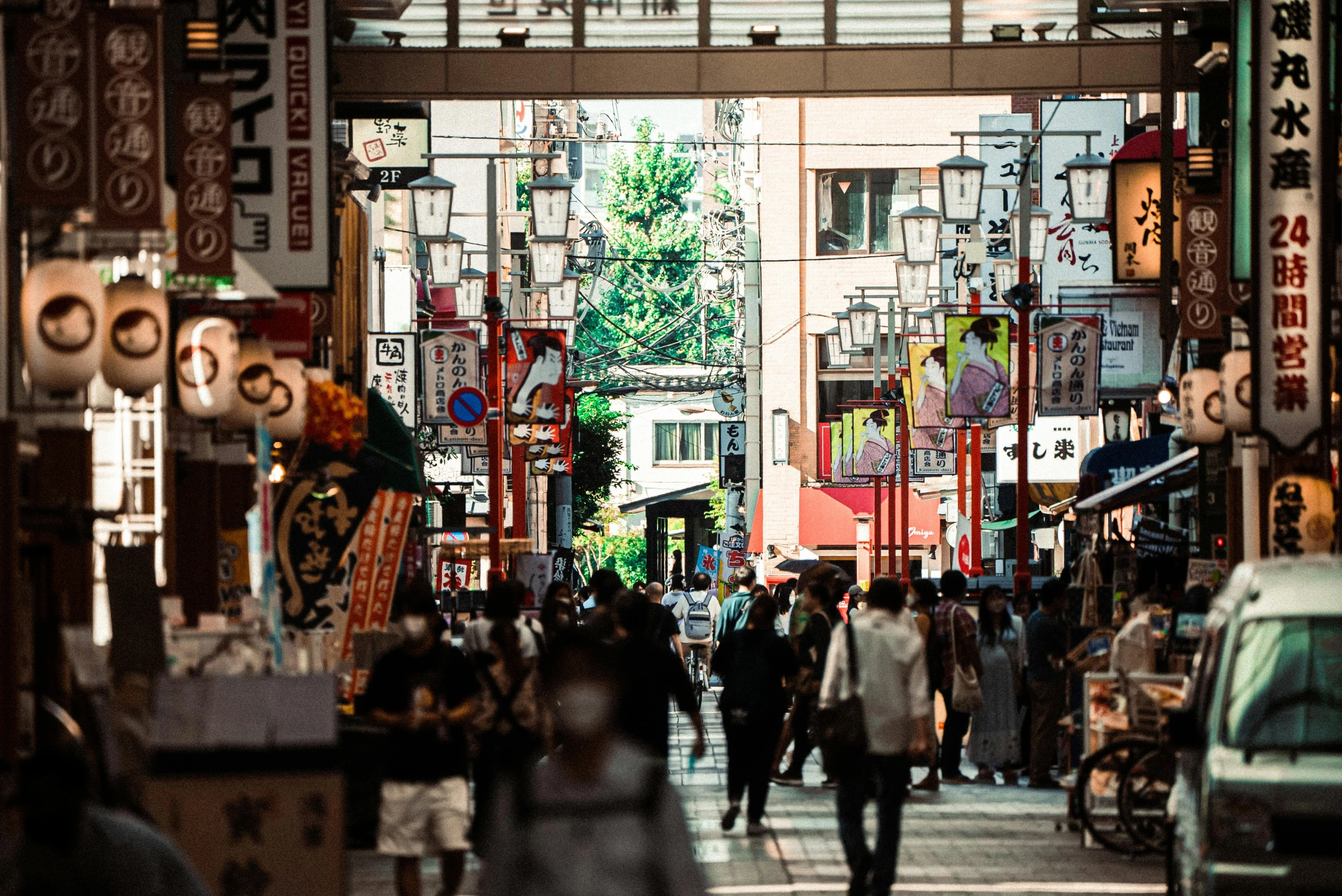 a city street with many signs and people walking