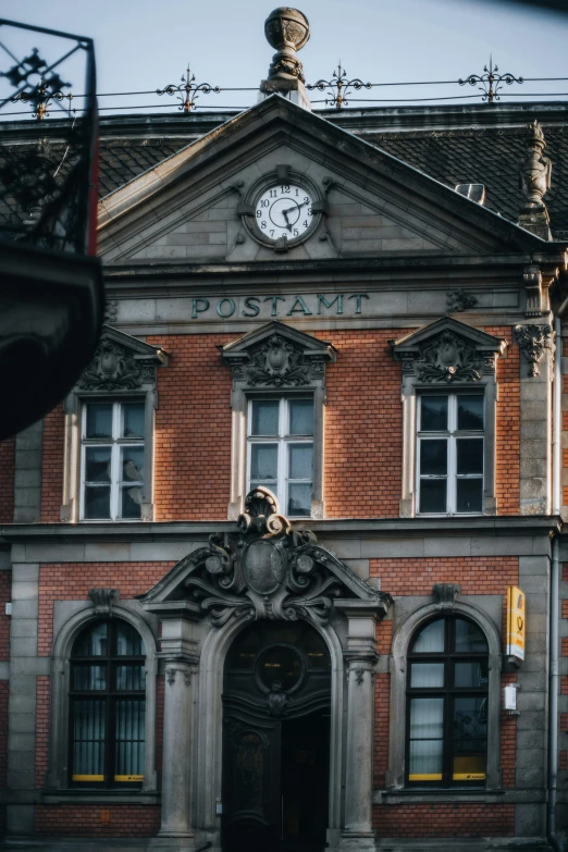 a building with a clock that is mounted on top