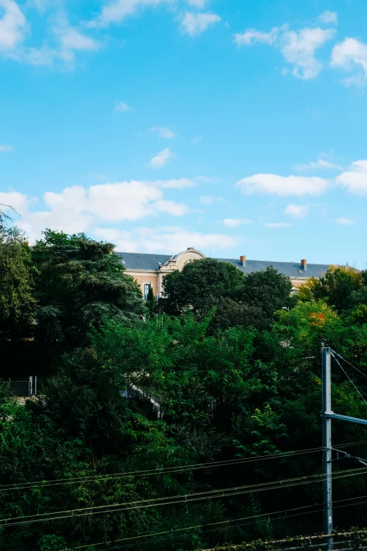 the sky is very bright blue with some clouds above the houses