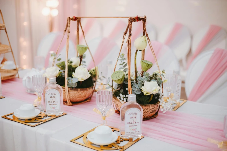 there are two wedding flowers in the centerpieces on a table