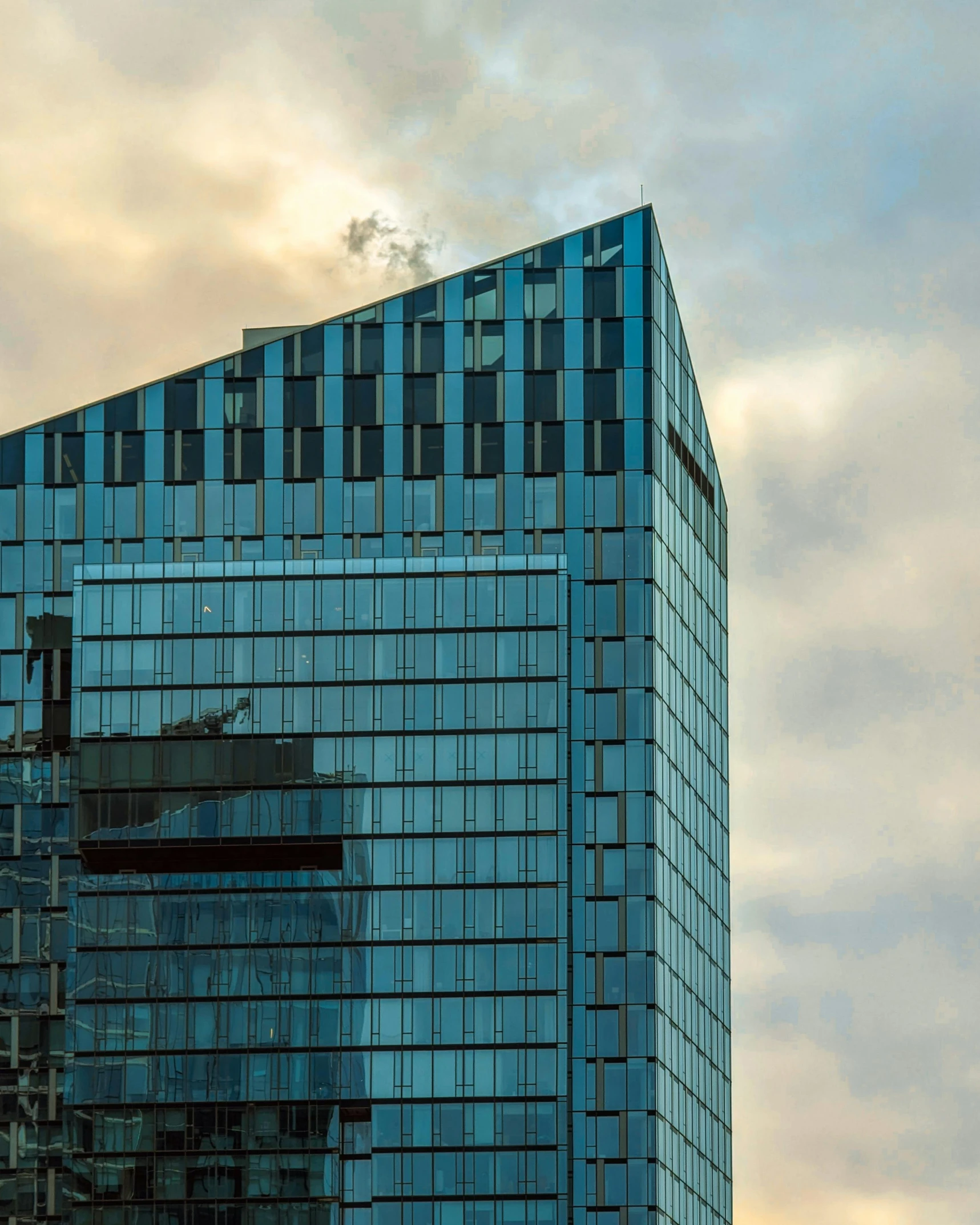 a very tall building with lots of windows on the top