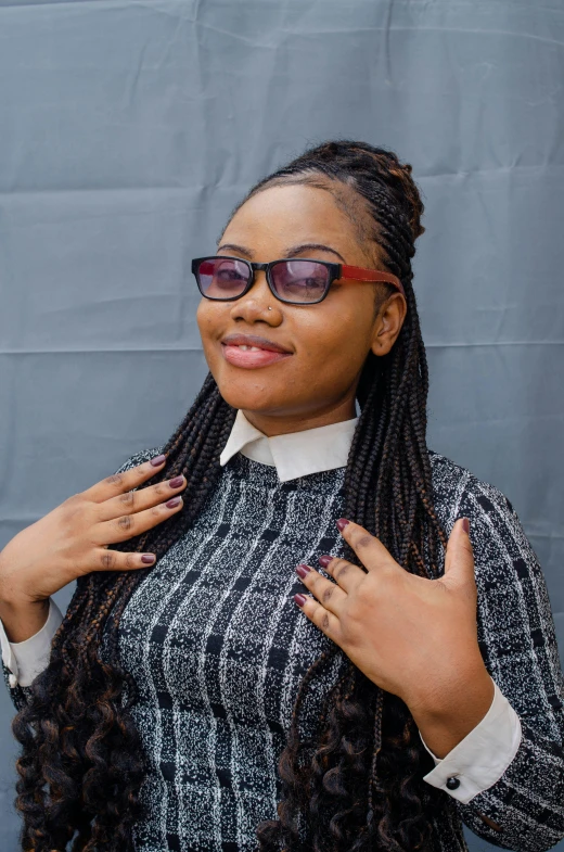 a woman with dreadlocks and sunglasses has long id hair