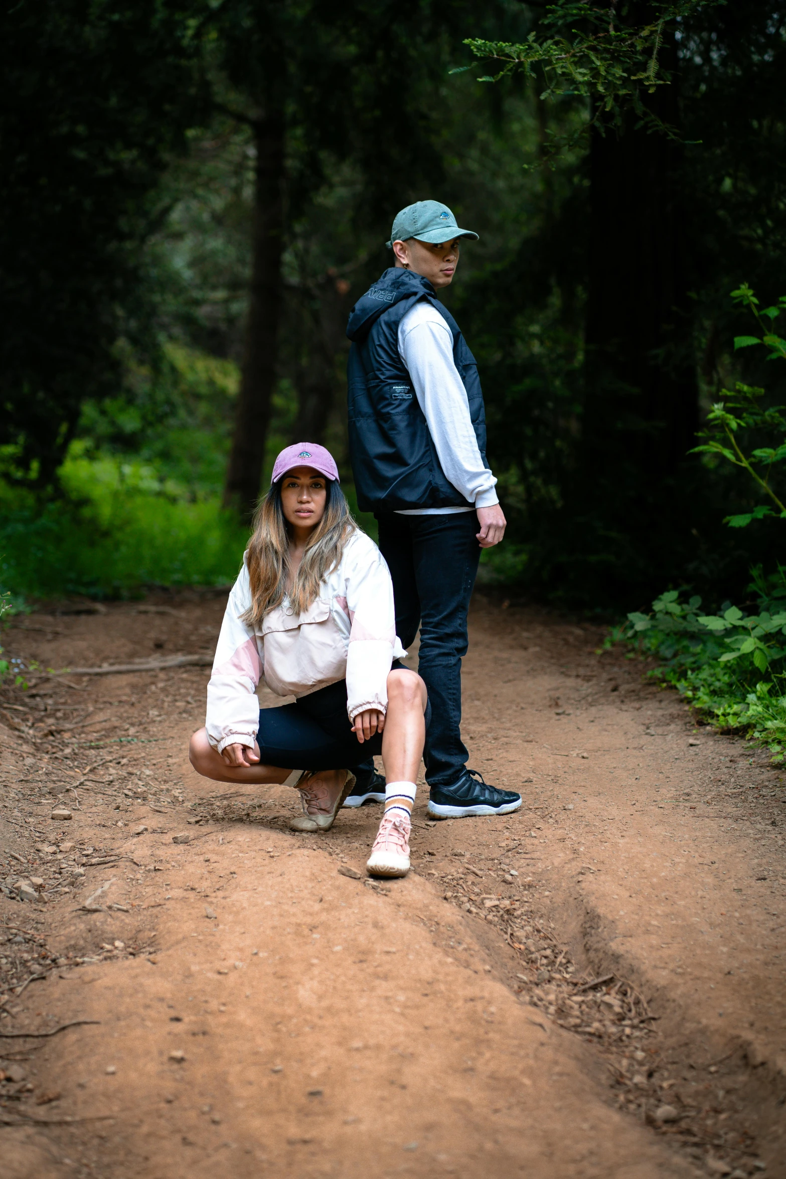 a man standing next to a young woman