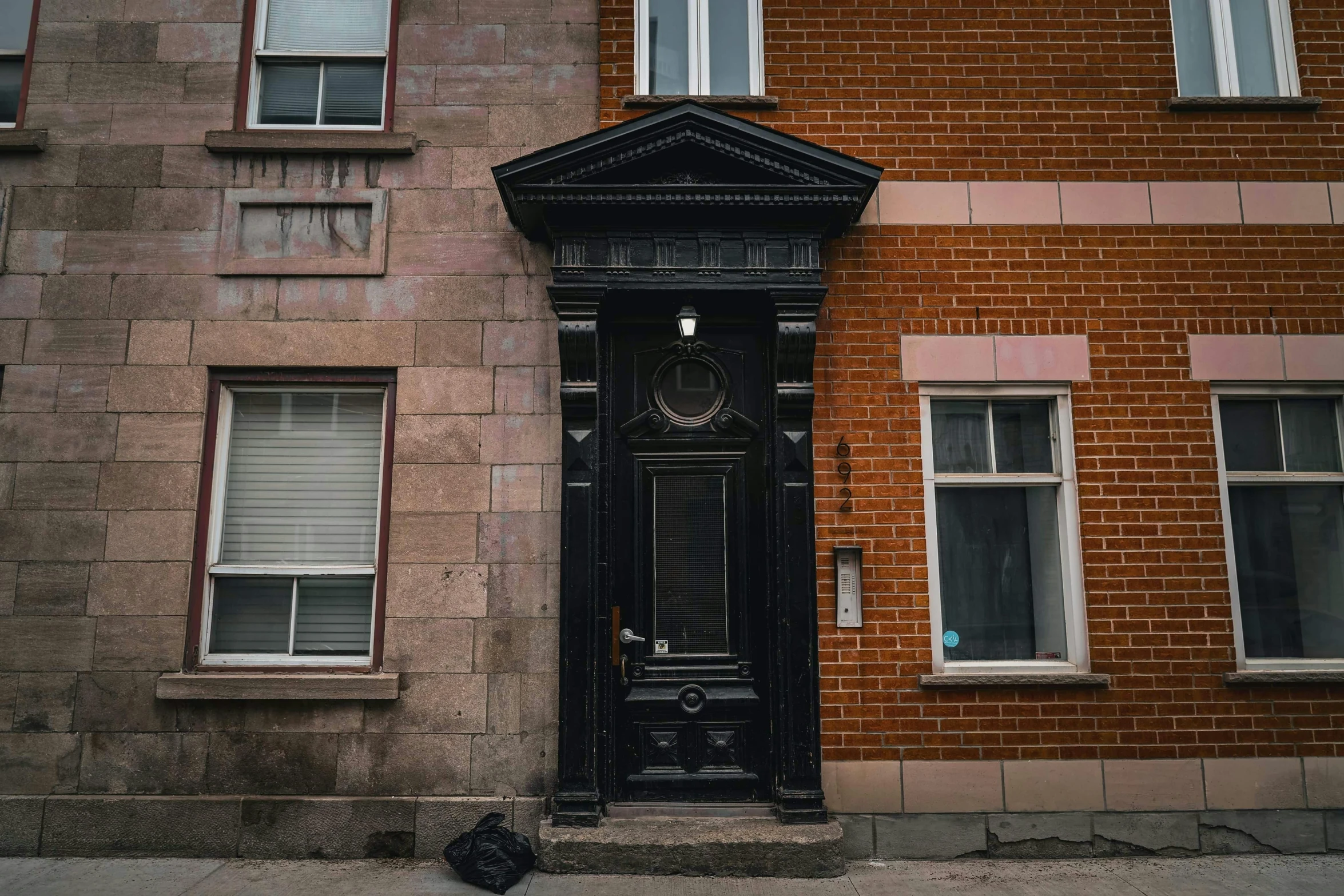 a large clock on the side of a brick building