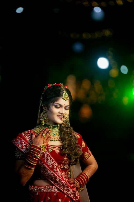 a woman with a red and white dress on standing