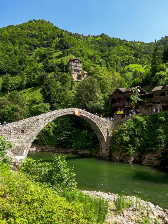 there is a bridge that crosses over a stream