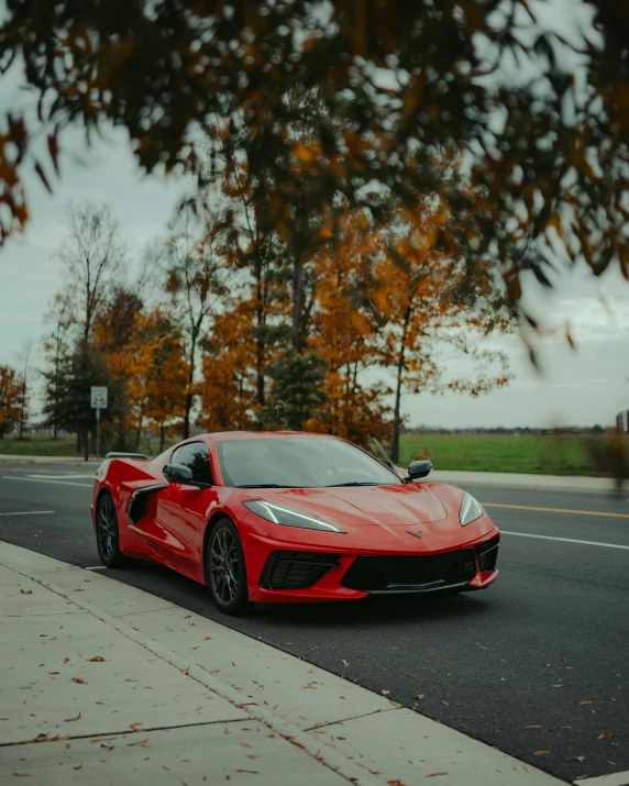 a red sports car on the side of the road