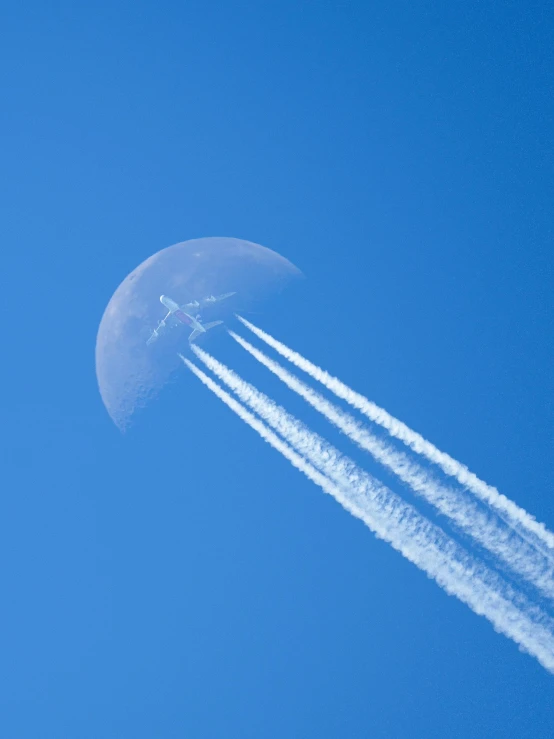 two planes pass each other on their way across the sky