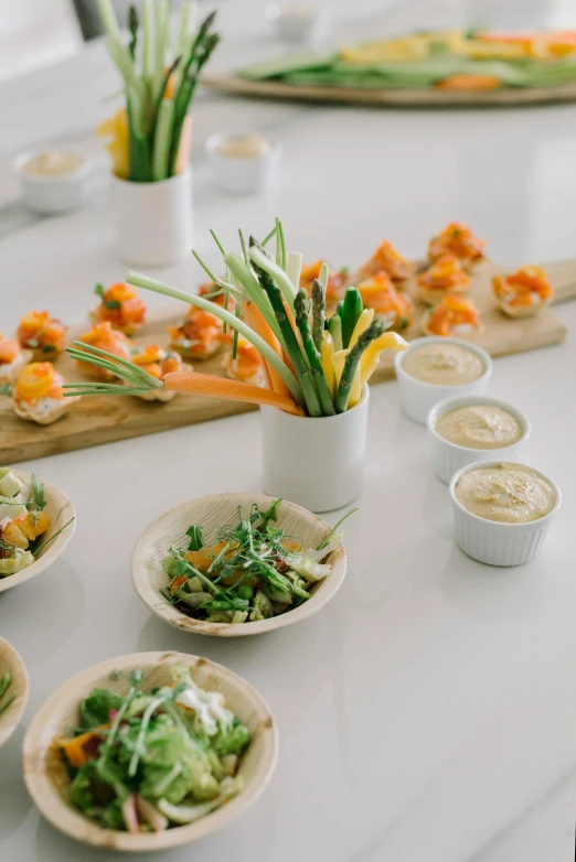 an array of plates with various vegetables on them