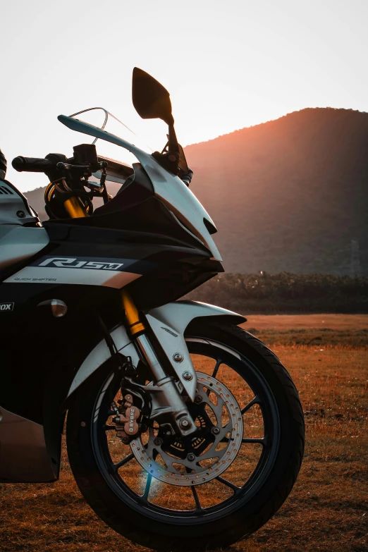 the motorcycle is parked on the side of the road