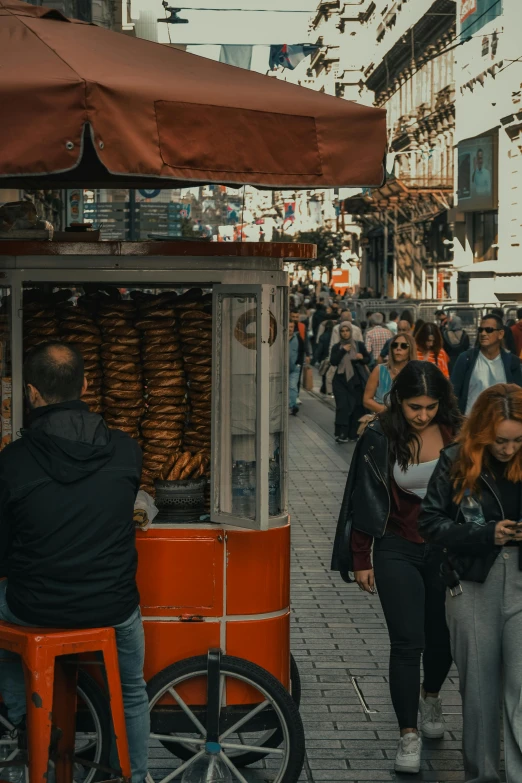 an outdoor food vendor on a busy street