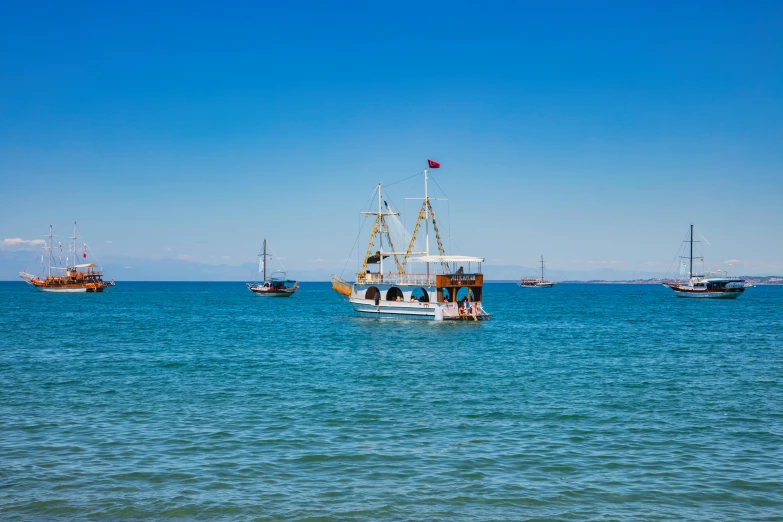 a group of boats that are in the ocean