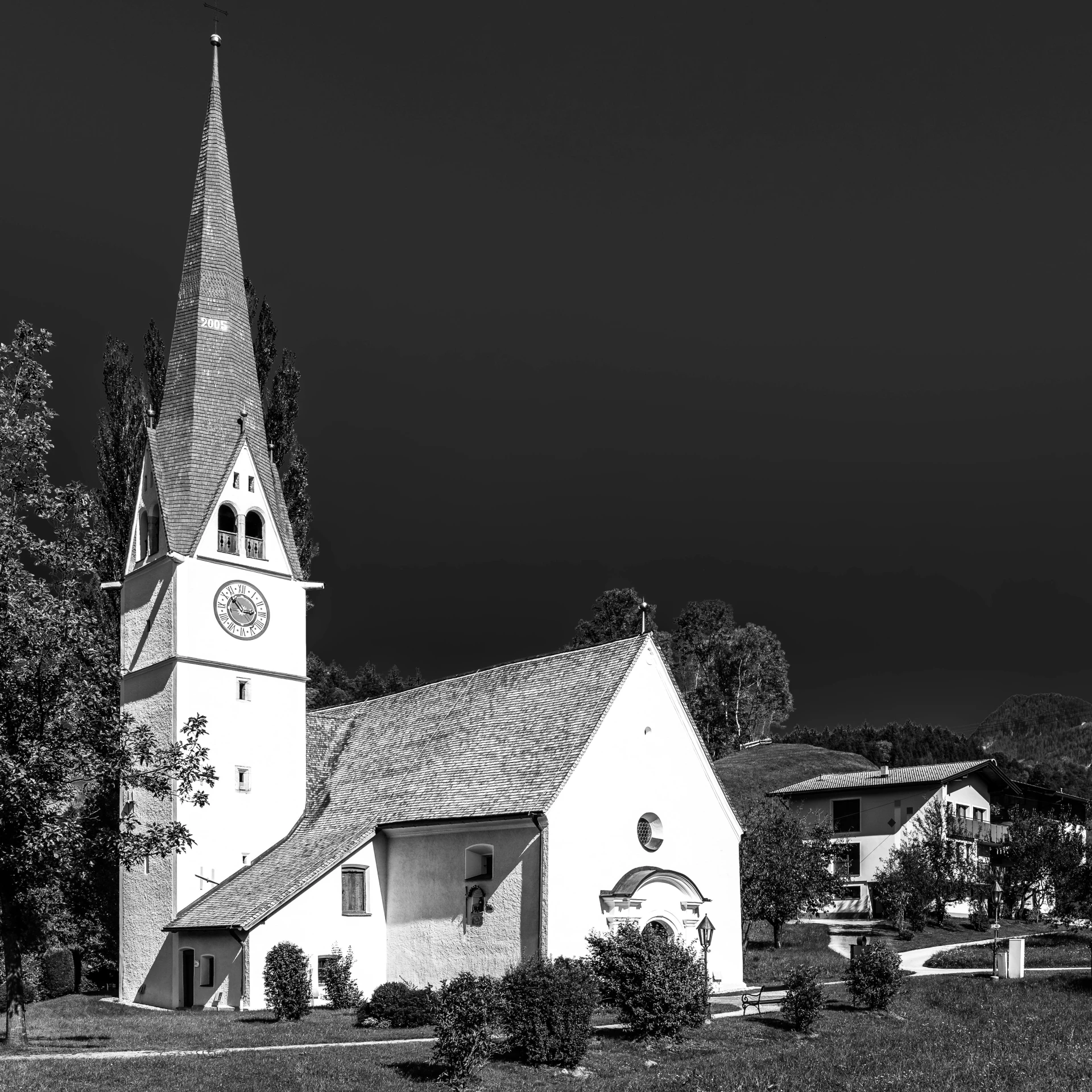 an old church with a clock on the steeple