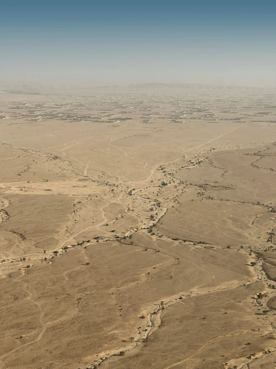 aerial view looking out an airplane at the desert